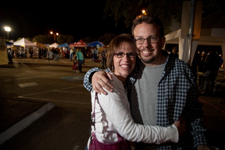 A couple poses for a photo at a community fall festival in College Station, Texas.